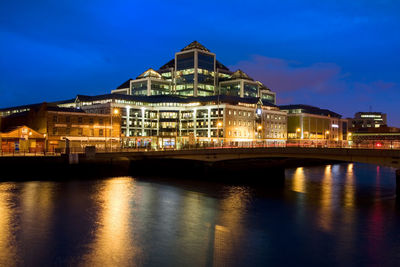 Illuminated buildings at waterfront