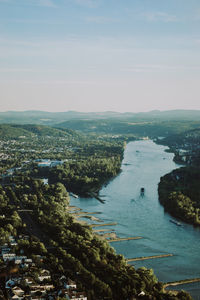 High angle view of buildings and sea against sky