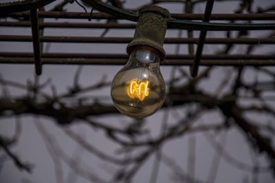 Low angle view of illuminated light bulb