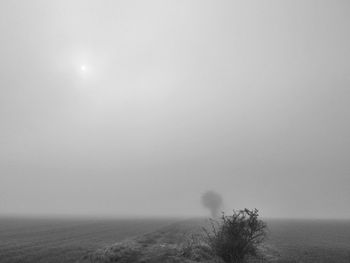 Scenic view of landscape against cloudy sky