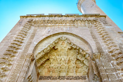 Low angle view of temple against building