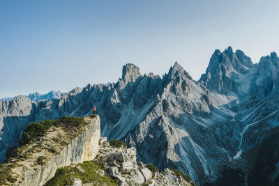 Panoramic view of rocky mountains against clear sky