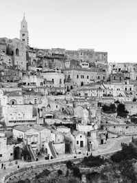 High angle view of old buildings in city against clear sky