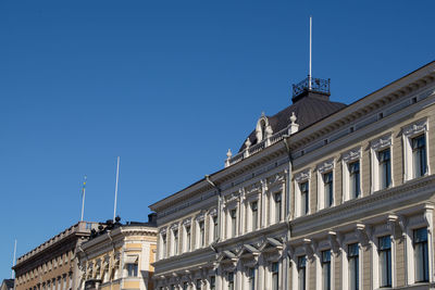 Low angle view of building against blue sky