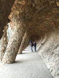 Rear view of people on rock formation