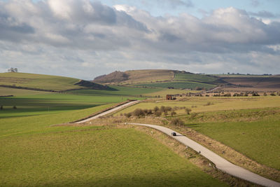 Scenic view of agricultural landscape against sky