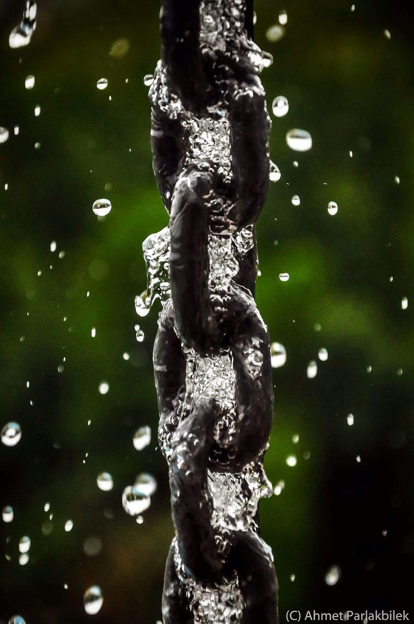 water, human representation, statue, sculpture, focus on foreground, reflection, motion, art, low angle view, close-up, outdoors, day, drop, creativity, art and craft, nature, splashing, full length, wet