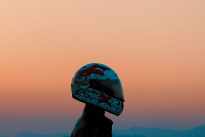 Side view of woman wearing hat