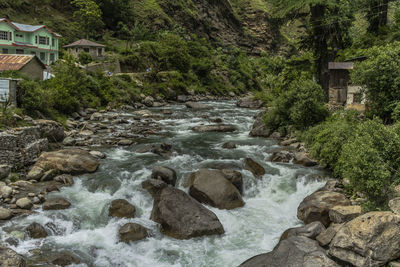 Stream flowing through rocks in river