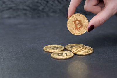Close-up of hand holding coins