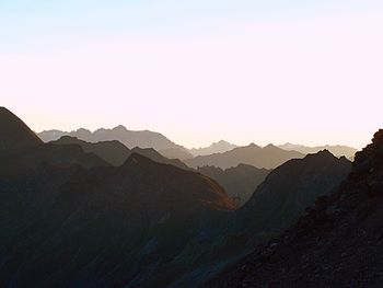 Scenic view of silhouette mountains against clear sky