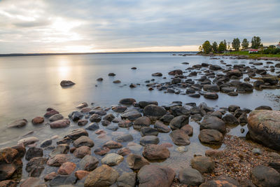 Scenic view of sea against sky at sunset