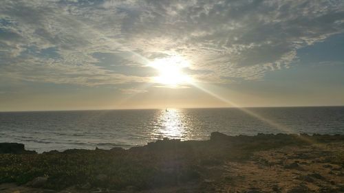 Scenic view of sea at sunset