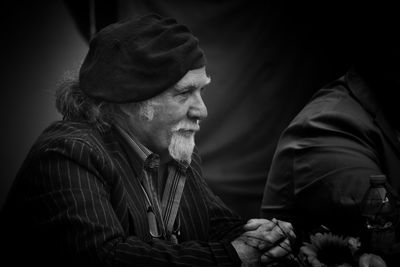 Side view of man looking away outdoors