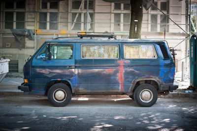 Side view of old vintage car on street