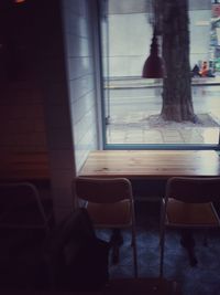 Low section of person on table by window
