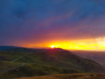 Scenic view of landscape against sky during sunset