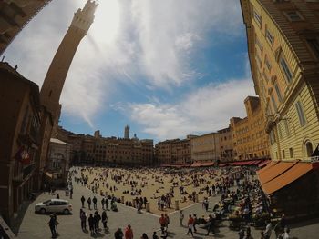 People walking in front of buildings
