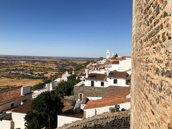 View of town against blue sky