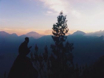 Silhouette of mountain against sky at sunset