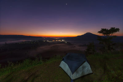 Scenic view of landscape against sky at night