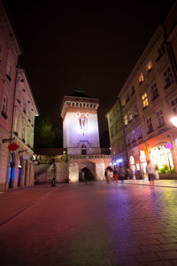 Illuminated buildings in city at night