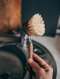 Dishwashing brush in the hand