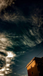 Low angle view of built structure against cloudy sky