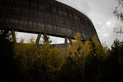 Low angle view of building against cloudy sky