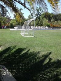 Scenic view of grassy field against sky
