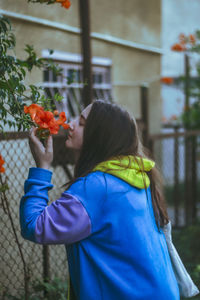 Rear view of woman holding bouquet