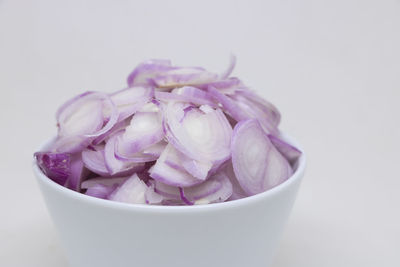 Close-up of purple flower in bowl