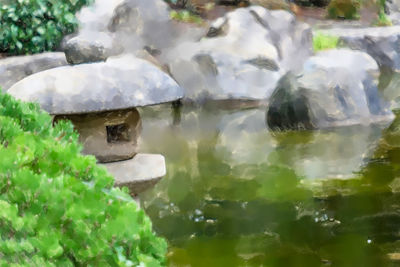 Close-up of stones in lake