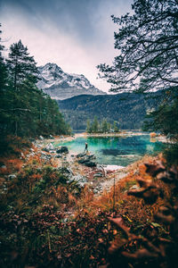 Scenic view of lake and mountains against sky