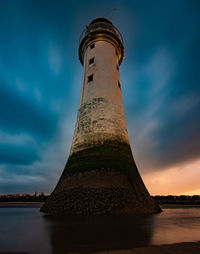 Low angle view of lighthouse against blue sky