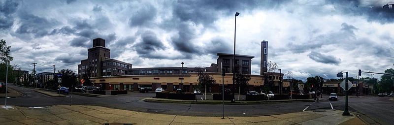 City street against cloudy sky