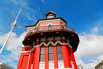 Low angle view of red building against sky