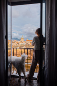 Dog standing by window