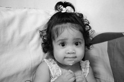 Portrait of cute baby girl with food