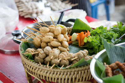 Close-up of vegetables in basket on table at market stall