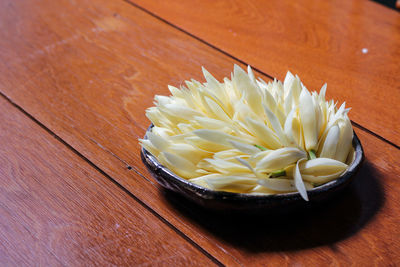 High angle view of white flower on table