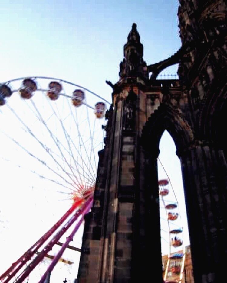 amusement park, amusement park ride, ferris wheel, built structure, architecture, arts culture and entertainment, clear sky, famous place, day, travel destinations, arch, sky, tourism, outdoors, fragility, fairground, no people, big wheel, fairground ride, local landmark, international landmark, city life