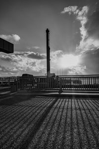 Sunrays on promenade with sea