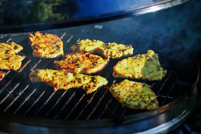 Close-up of meat on grill