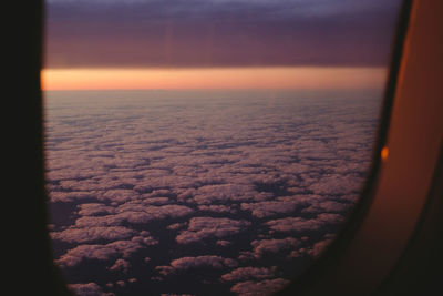 Scenic view of cloudscape seen through airplane window