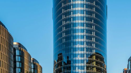 Low angle view of modern building against clear sky