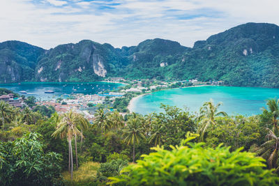 Scenic view of sea and mountains against sky