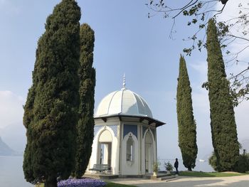 Built structure against trees and building against sky bellagio lake como