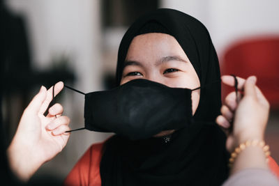 Close-up of girl wearing mask