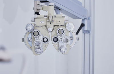 Phoropter, medical optometry and equipment in hospital for eye test or examination.